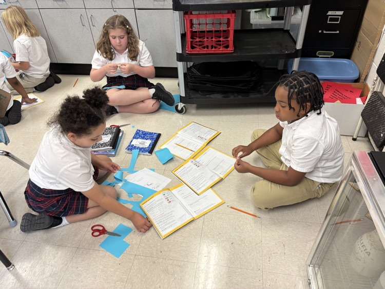 third graders doing a science experiment