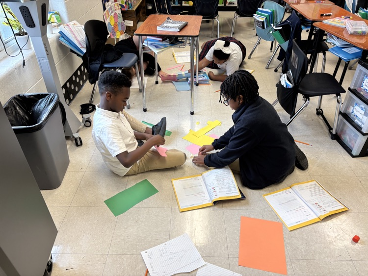 third graders doing a science experiment