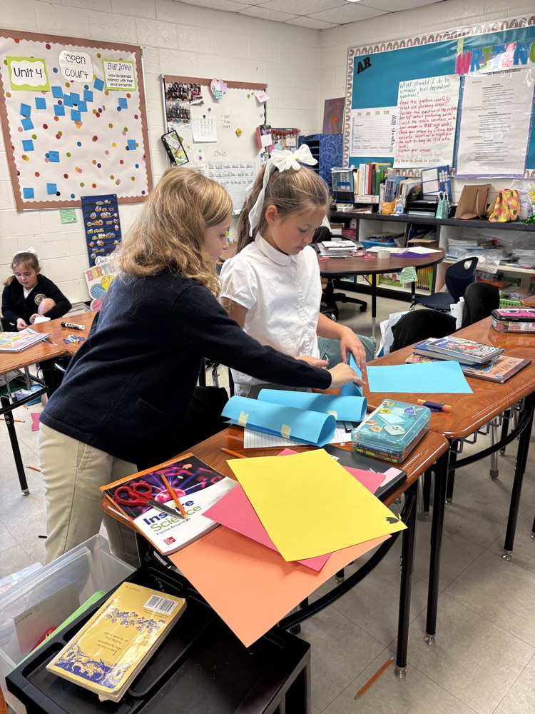 third graders doing a science experiment
