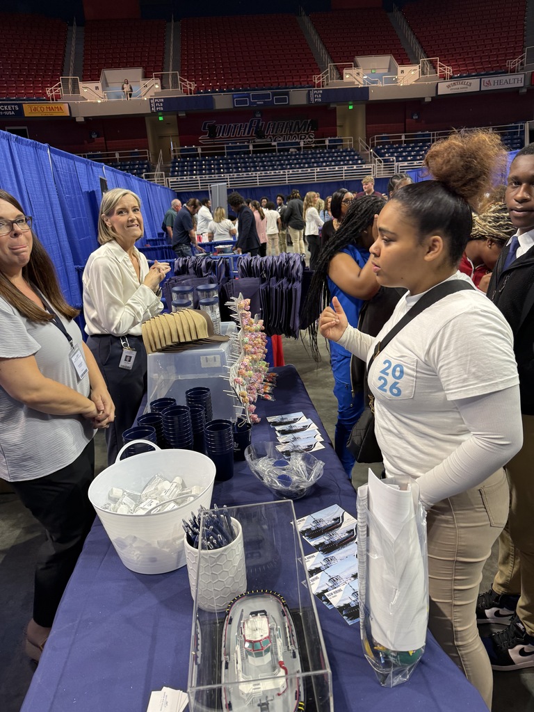 This student is full of questions at the Master Boat Builders booth!