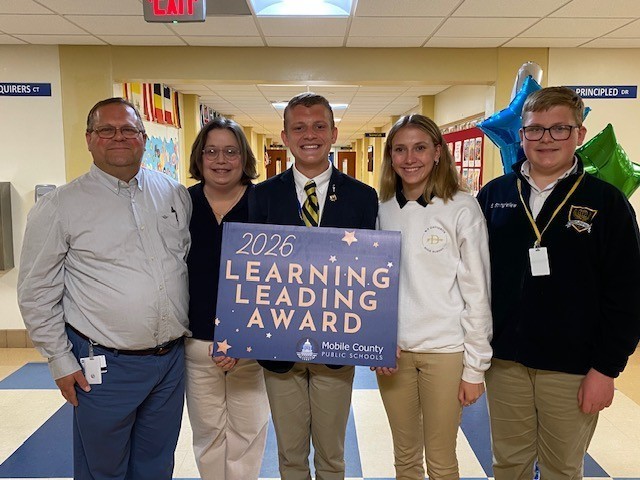 Ben Stringfellow stands with his family