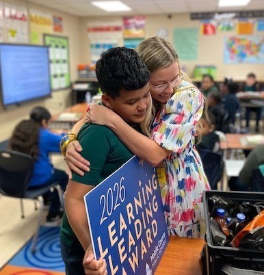 Gilliard teacher Krissy Brown hugs student Rylan Besaw