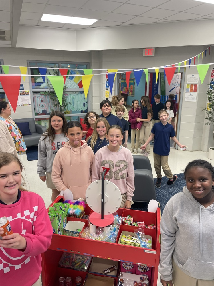 students lined up for prizes at the prize card