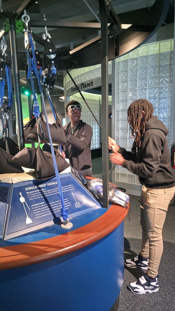 Students viewing an exhibit at the Maritime Museum.