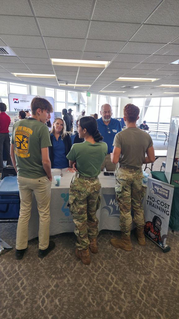 Students talking to representative from the Maritime Training Center.