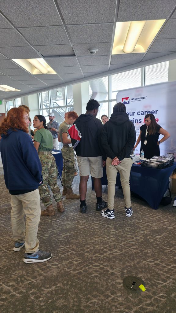 Students talking to representative from Norton Lilly.