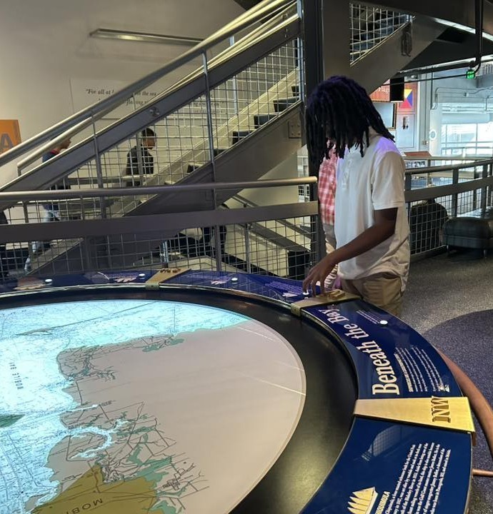A Williamson student looks at an exhibit