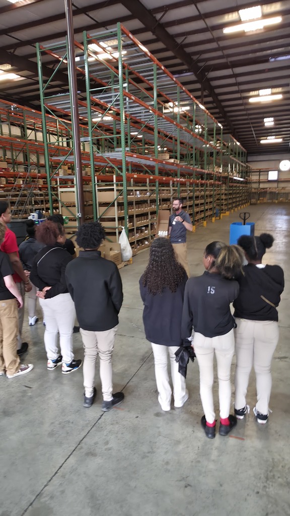 Students listen intently on the Educators Resource field trip.