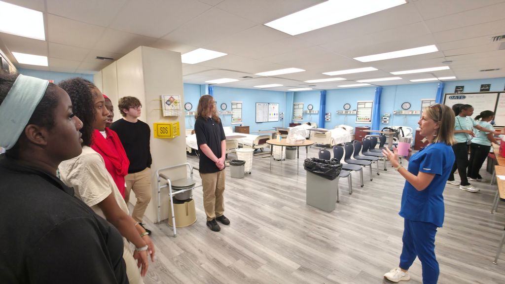 A group of students touring the health sciences class at The Bryant Center.