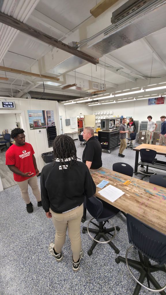 A group of students touring the HVAC classroom.