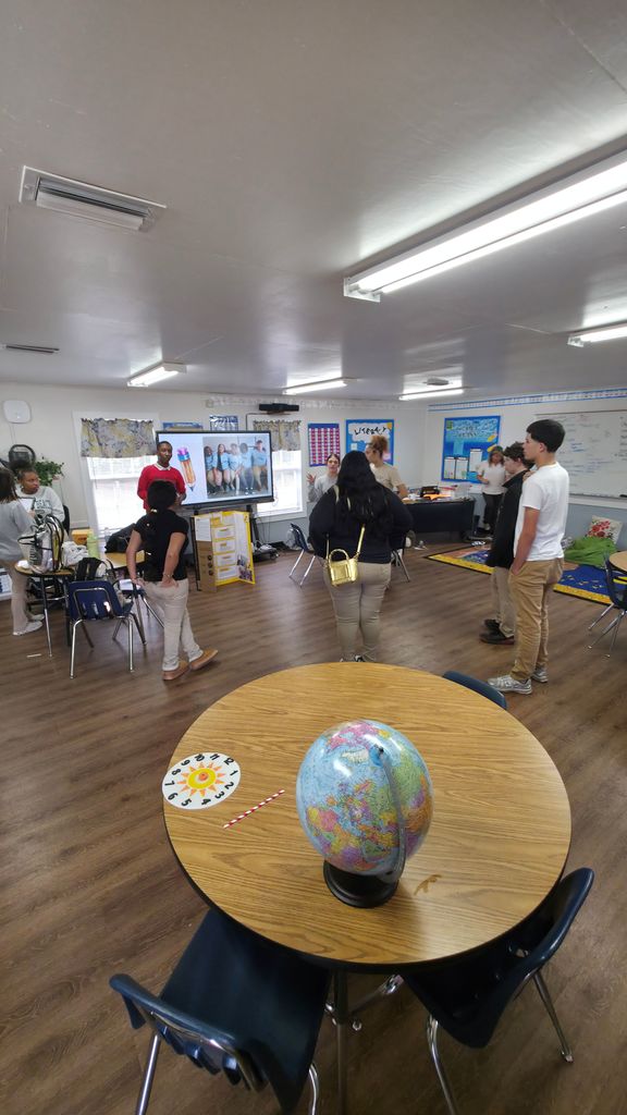 A group of students touring the education classroom.