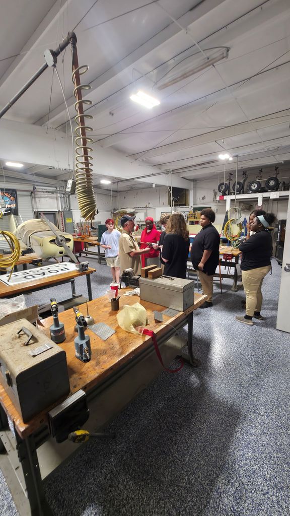 A group of students touring the Aviation class.
