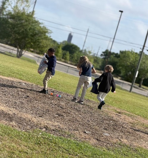 Students gathering eggs at an easter egg hunt 