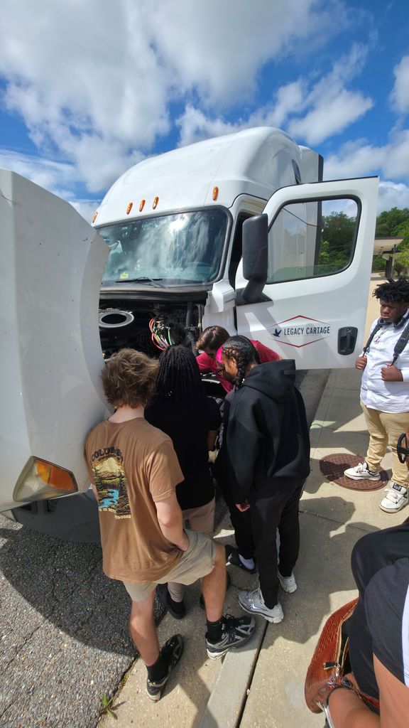 Getting a closer look under the hood of the Legacy Cartage truck.