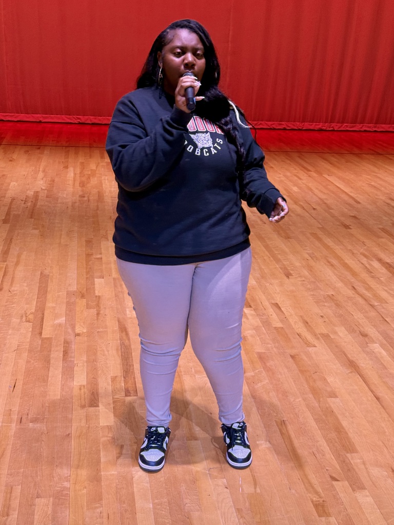 Assyria singing during the talent show. 