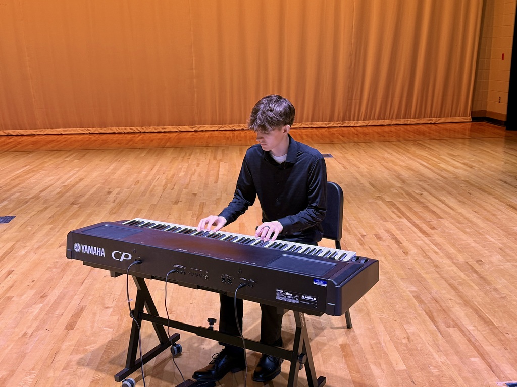 Cameron playing the keyboard.