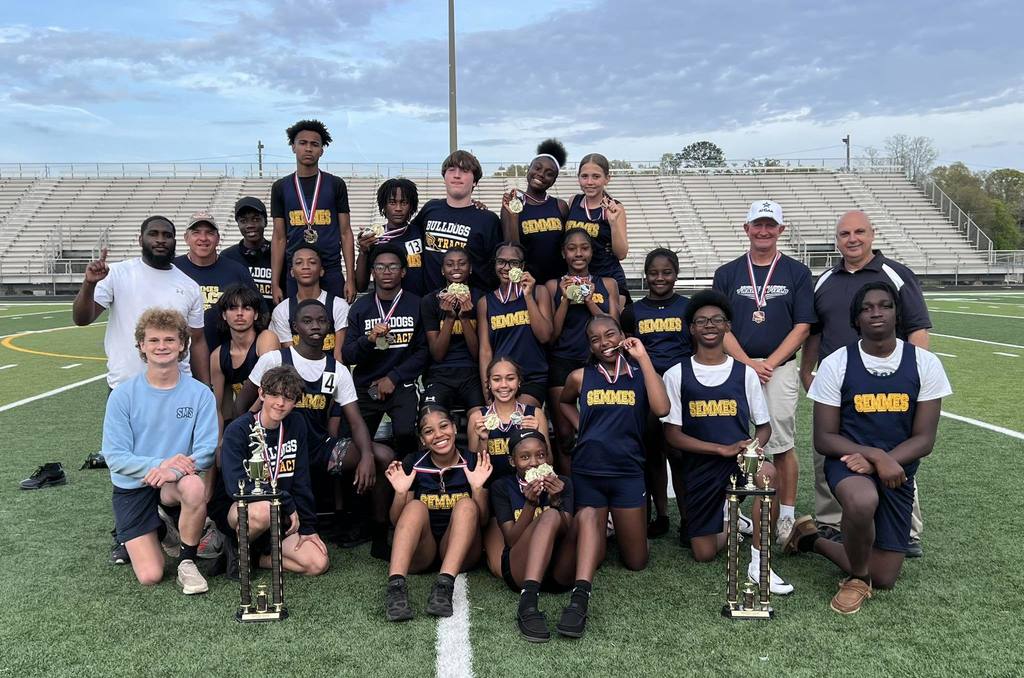 The Semmes Middle School track team with two trophies