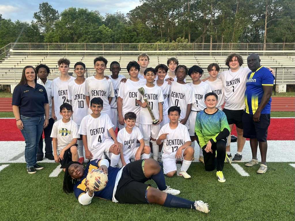 The Denton Magnet boys soccer team, with its trophy