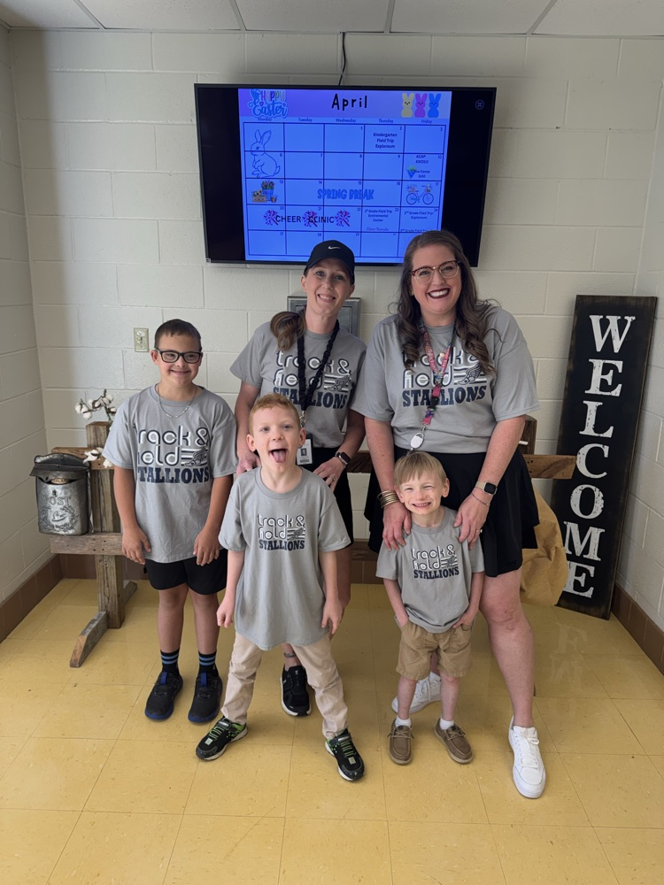 Teachers with Special Olympic athletes 