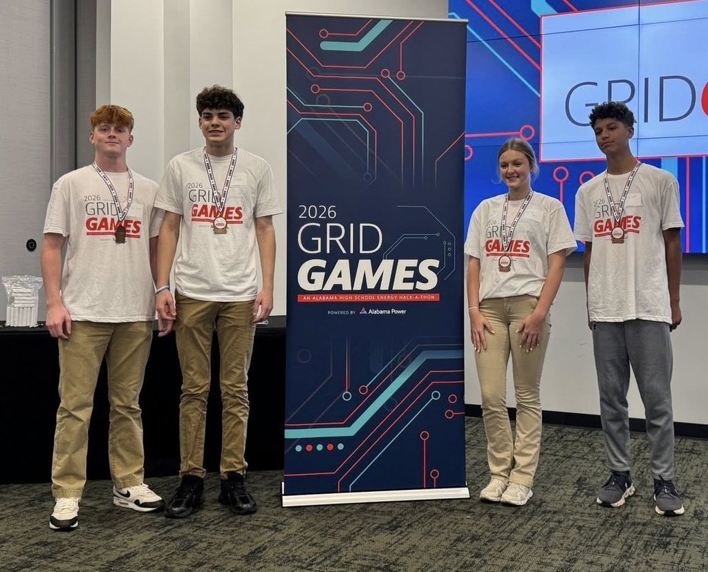 Four Citronelle High students wearing medals