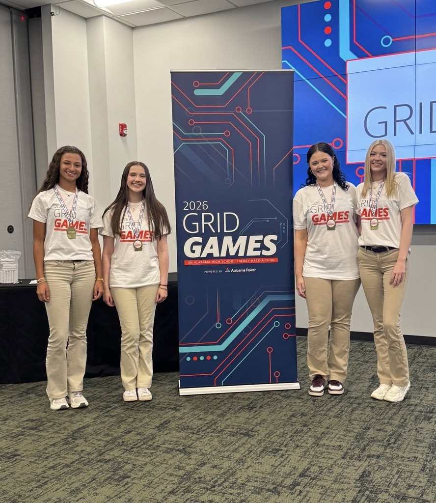 Four Citronelle High students wearing medals