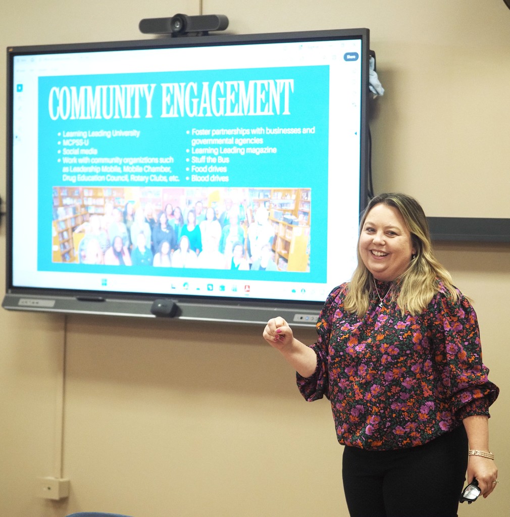 Rena Philips speaks to the class