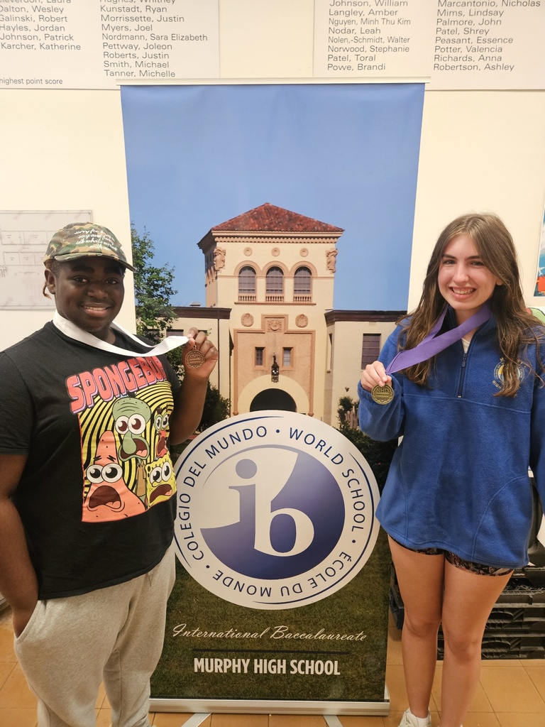 Two Murphy students wearing medals