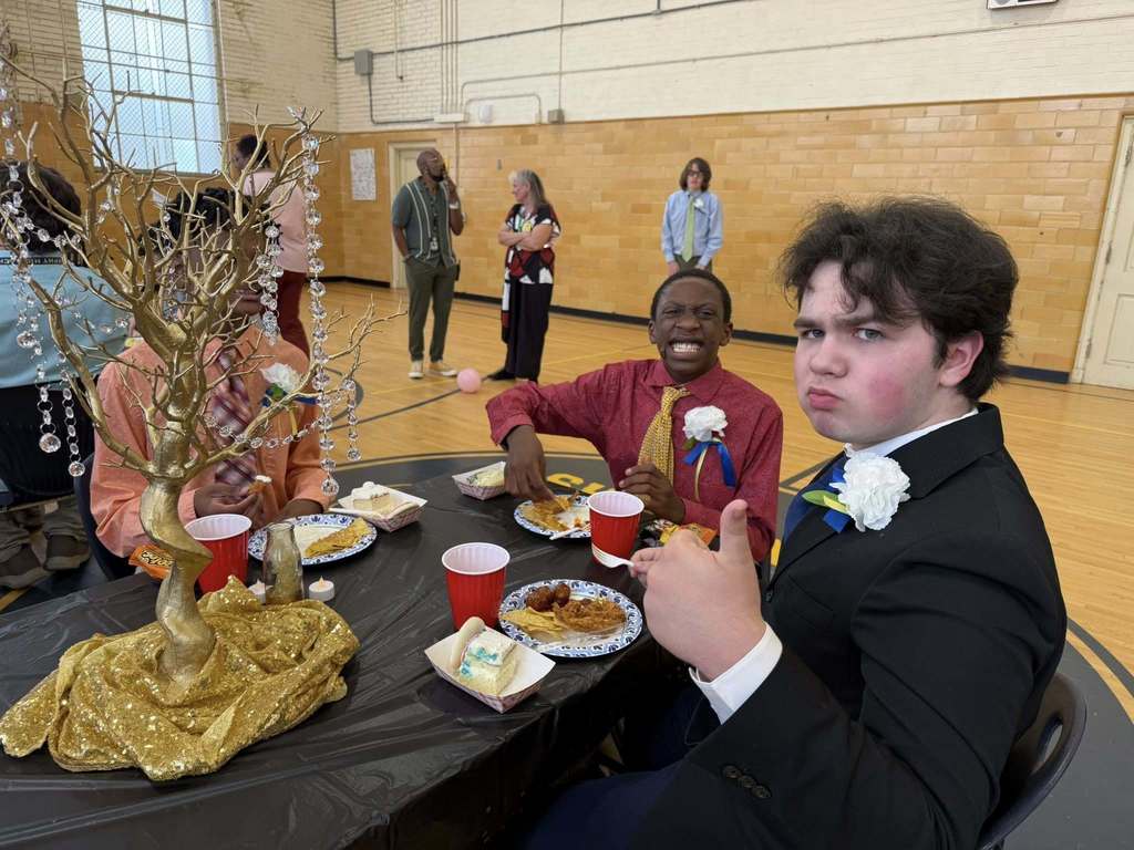 Murphy students eating at a table in the gymnasium