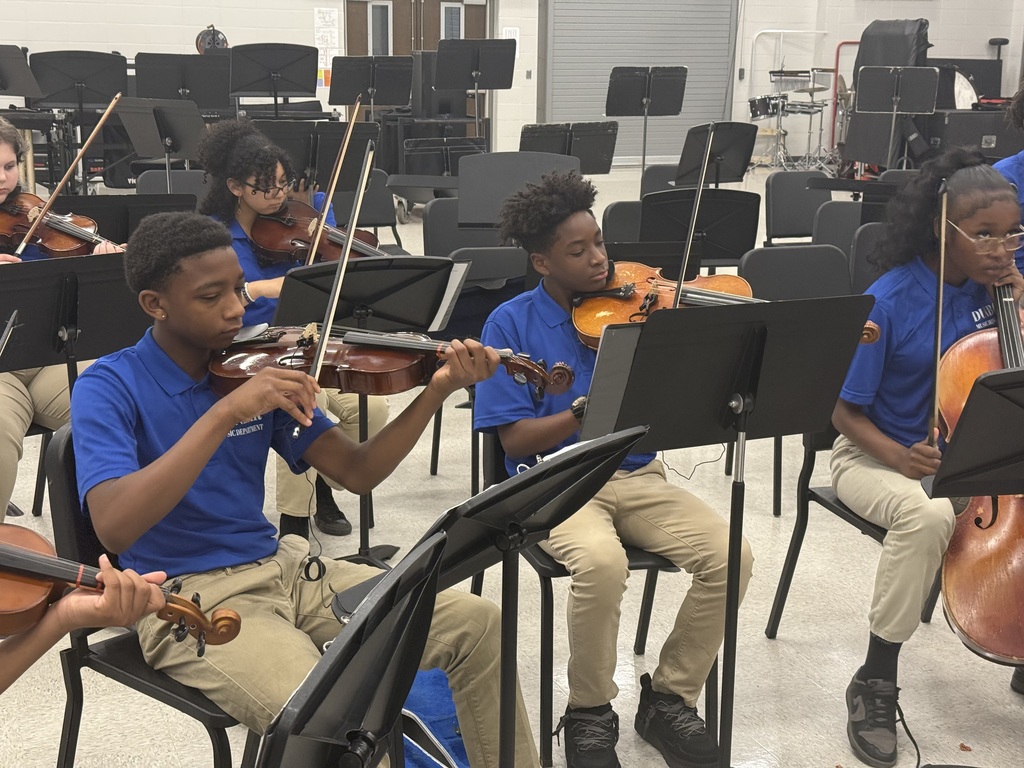 Ensemble members warming up in the THS band room before making their way to the stage.
