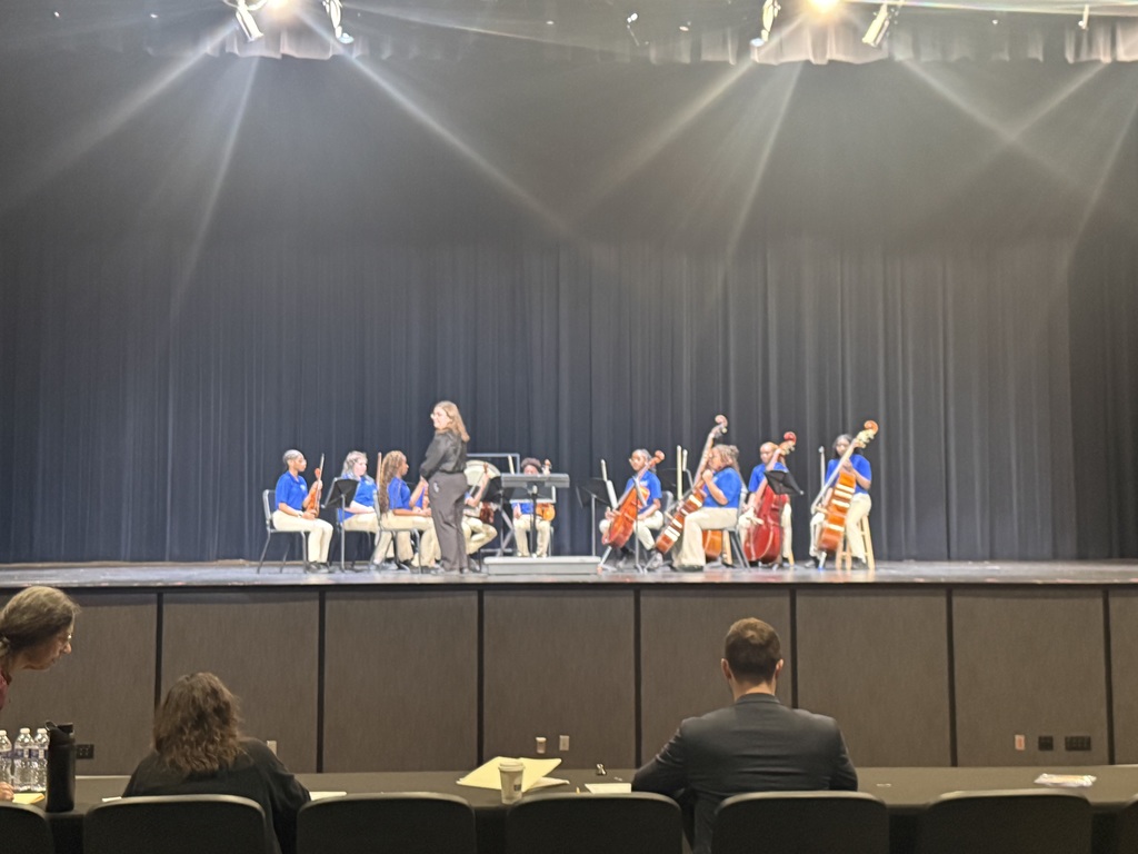 Dunbar String Orchestra on stage at OMPA, ready to perform.