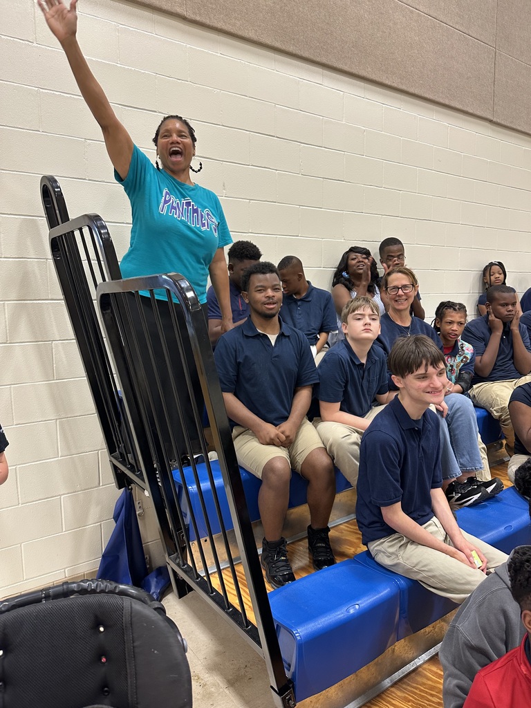 Staff and students in the cheering section 