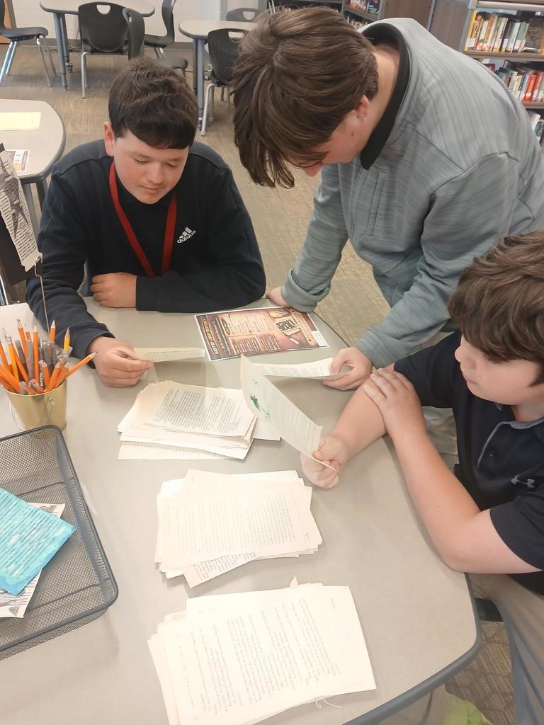 Students selecting a poem background