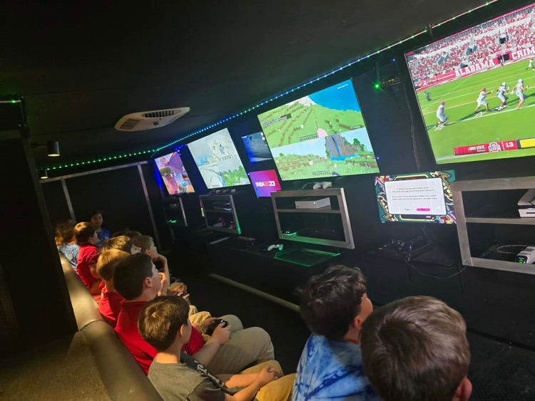 2nd-5th grade students playing on the game truck