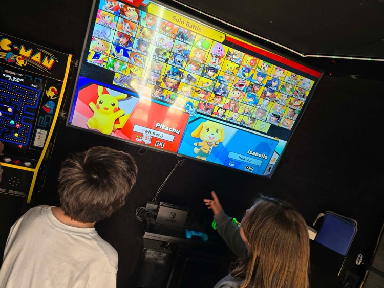 2nd-5th grade students playing on the game truck