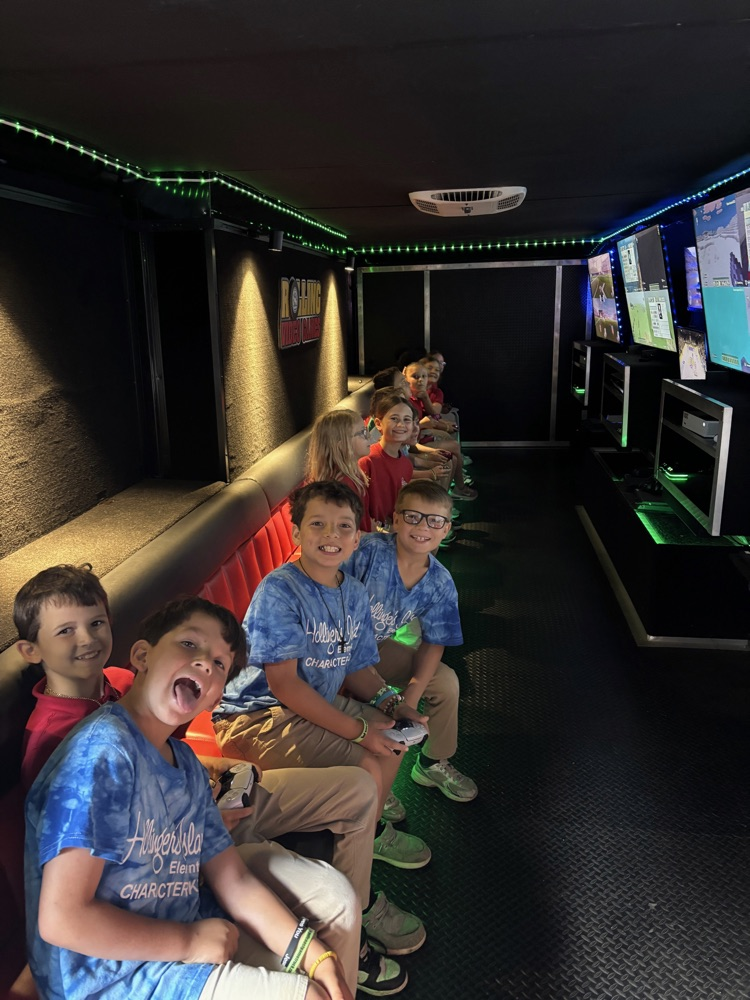 2nd-5th grade students playing on the game truck