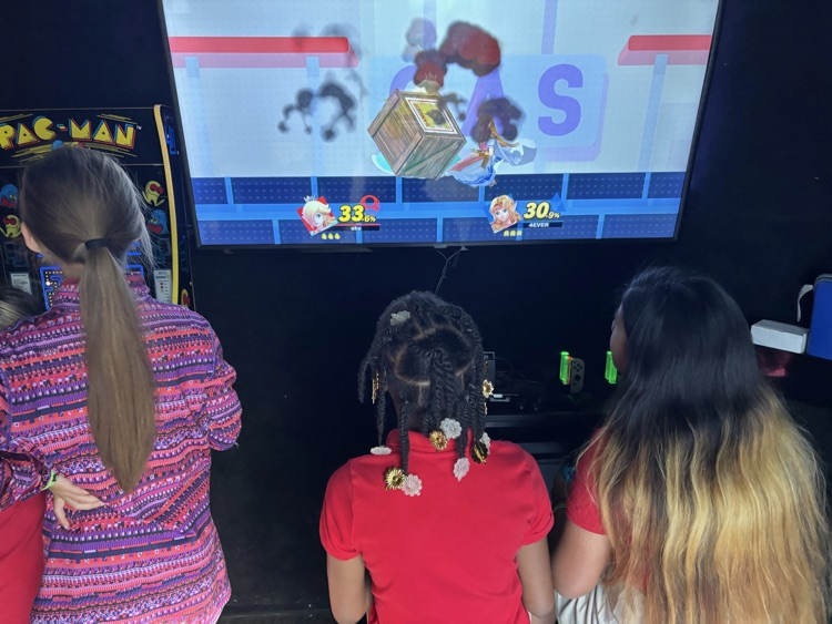 2nd-5th grade students playing on the game truck
