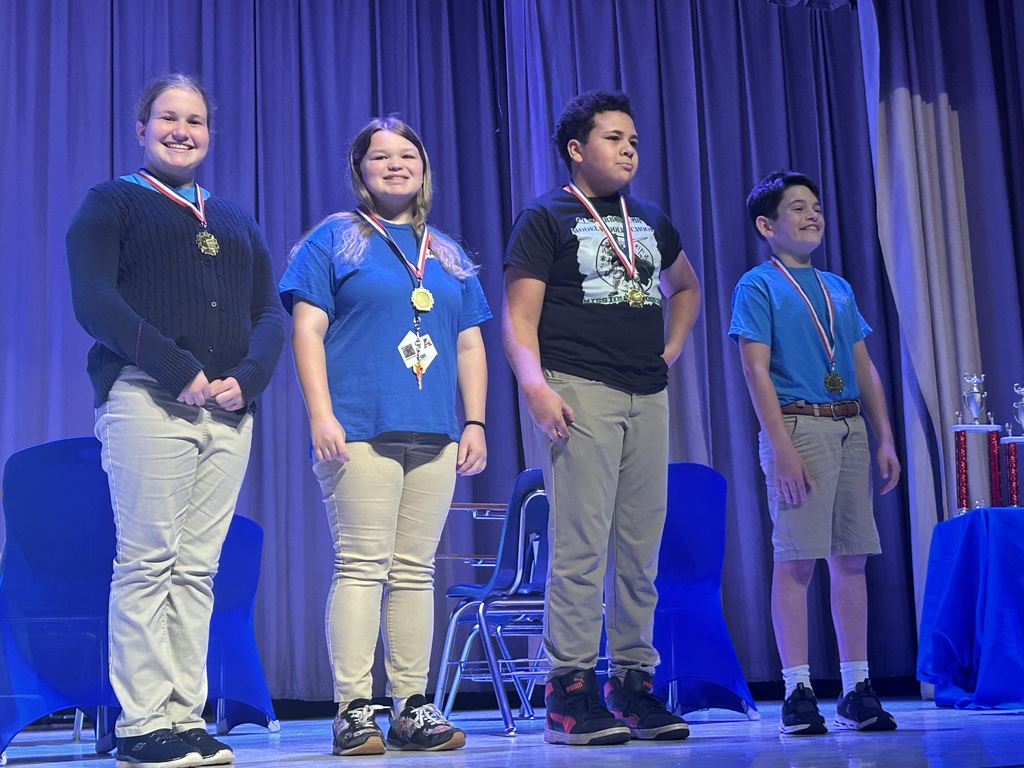 Group of students from math team getting medals