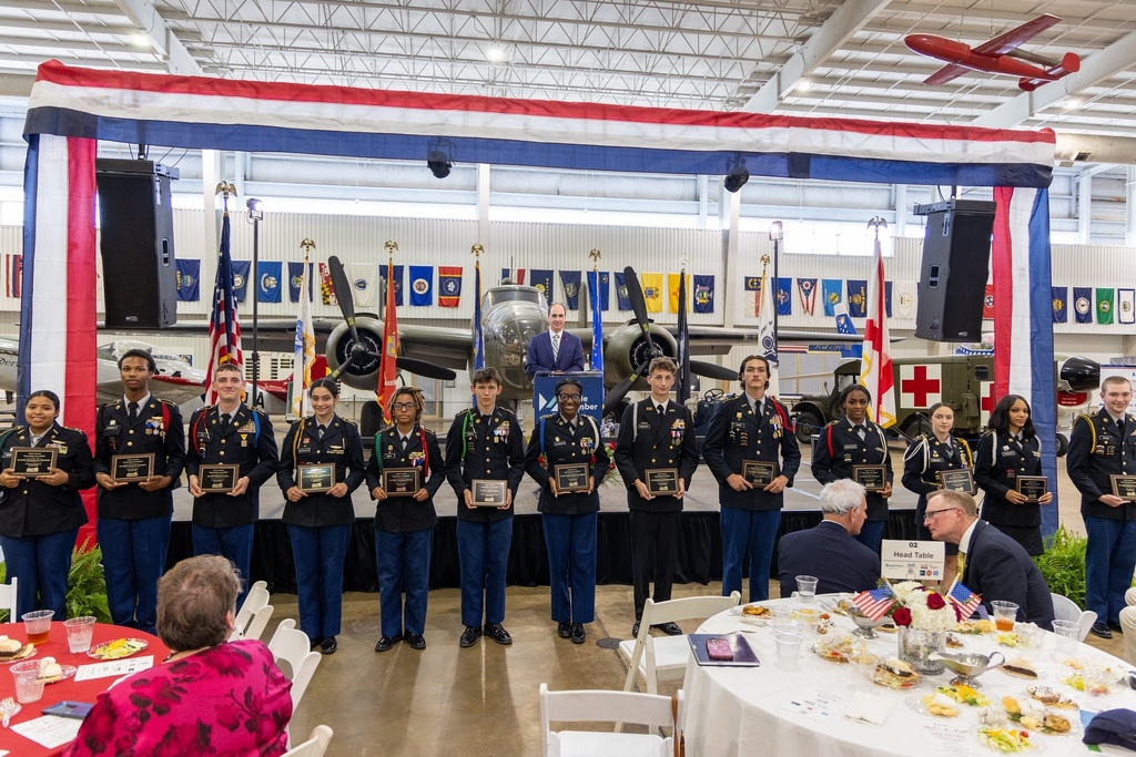 A line of JROTC cadets holding plaques
