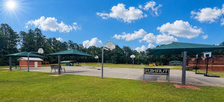 new benches with shades over them for students 