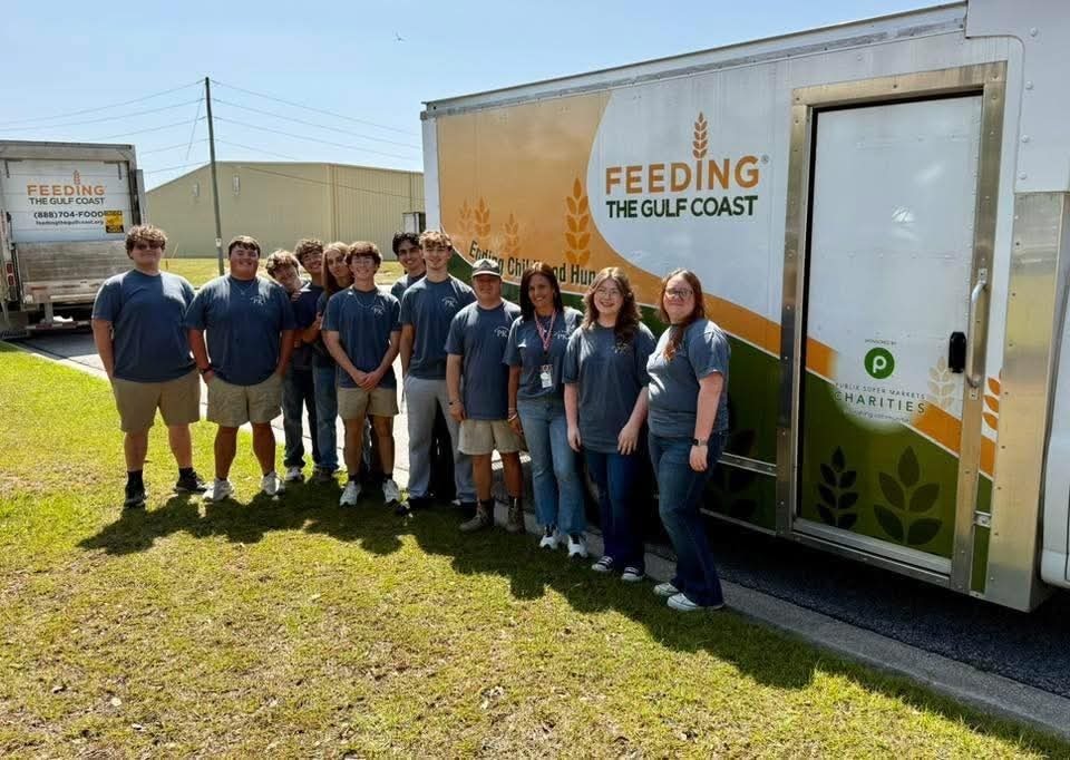 Senior members of our Rho Kappa Honor Society volunteering at Feeding the Gulf Coast.