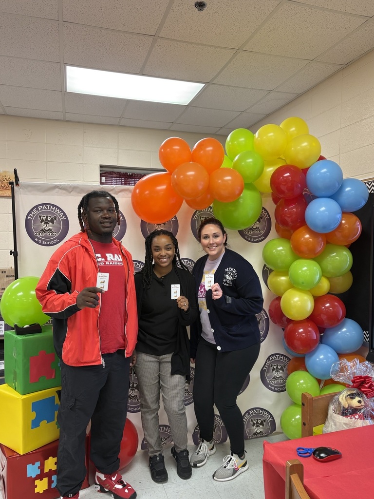 Teachers holding their prizes from teacher appreciation week 