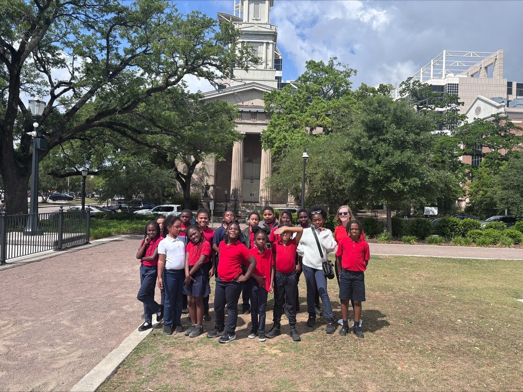 Students from Morningside Elementary standing in front of a historic building in downtown Mobile.