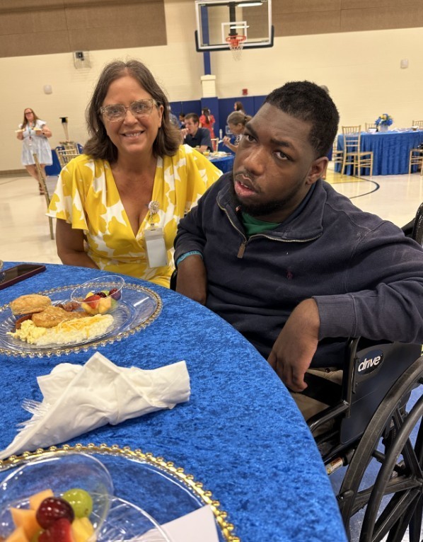 DD with his teacher eating breakfast 