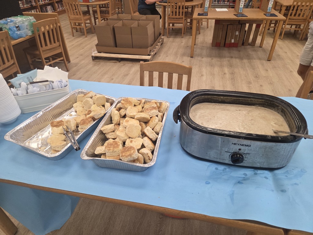 Biscuits and gravy on table 