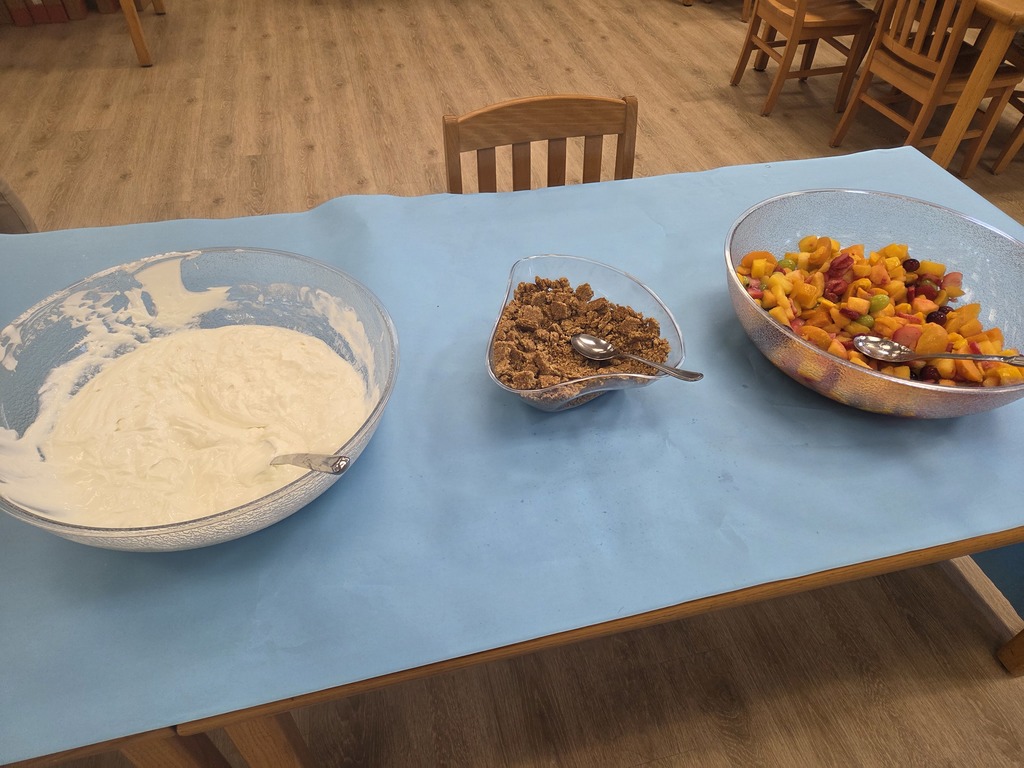 Yogurt and toppings on table 