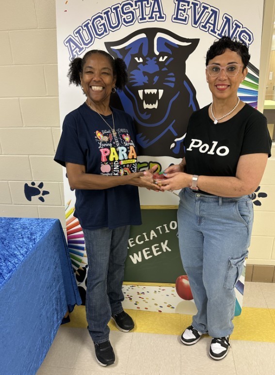 Mrs. Kidd with para holding a cupcake 