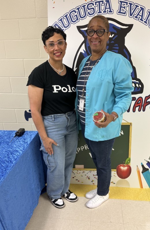 Mrs. Kidd with para holding a cupcake 