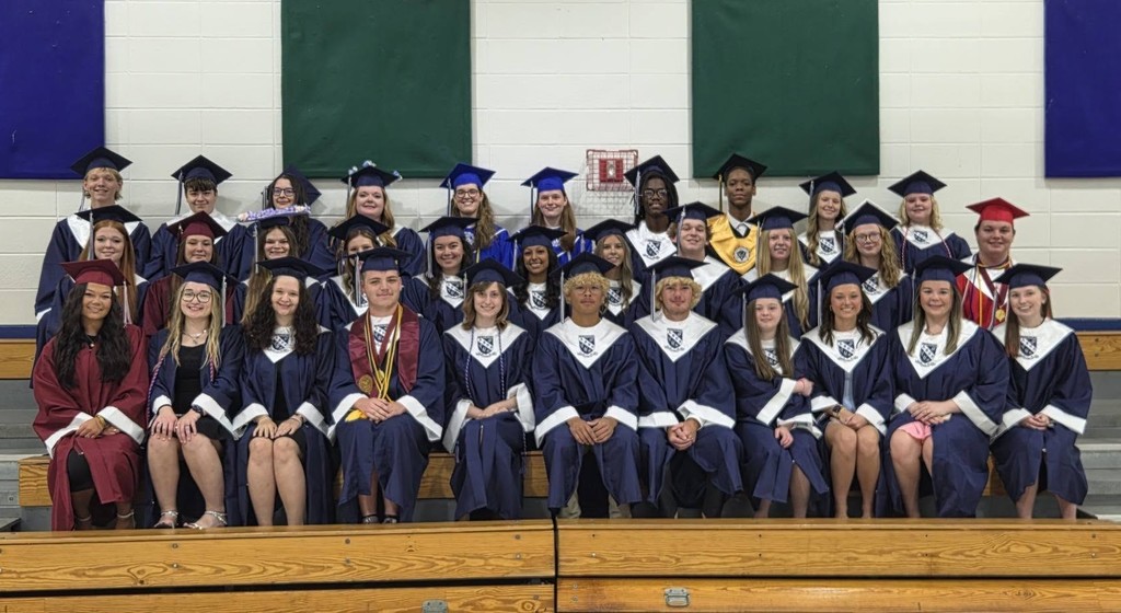 A group of seniors in caps and gowns at Breitling Elementary