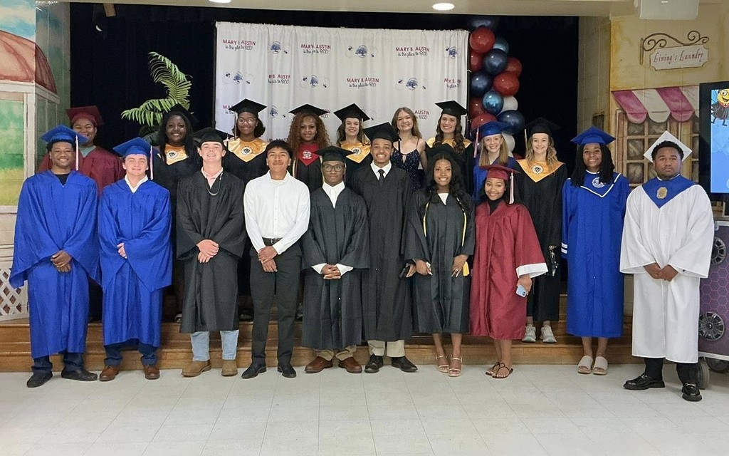 A group of seniors in caps and gowns at Mary B. Austin Elementary
