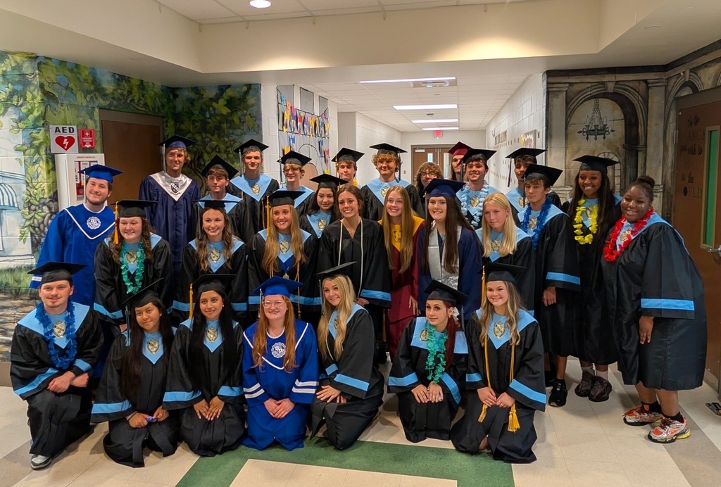 A group of seniors in caps and gowns at Tanner Williams Elementary
